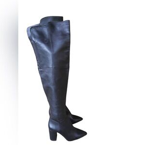 Black leather pointy toe boots